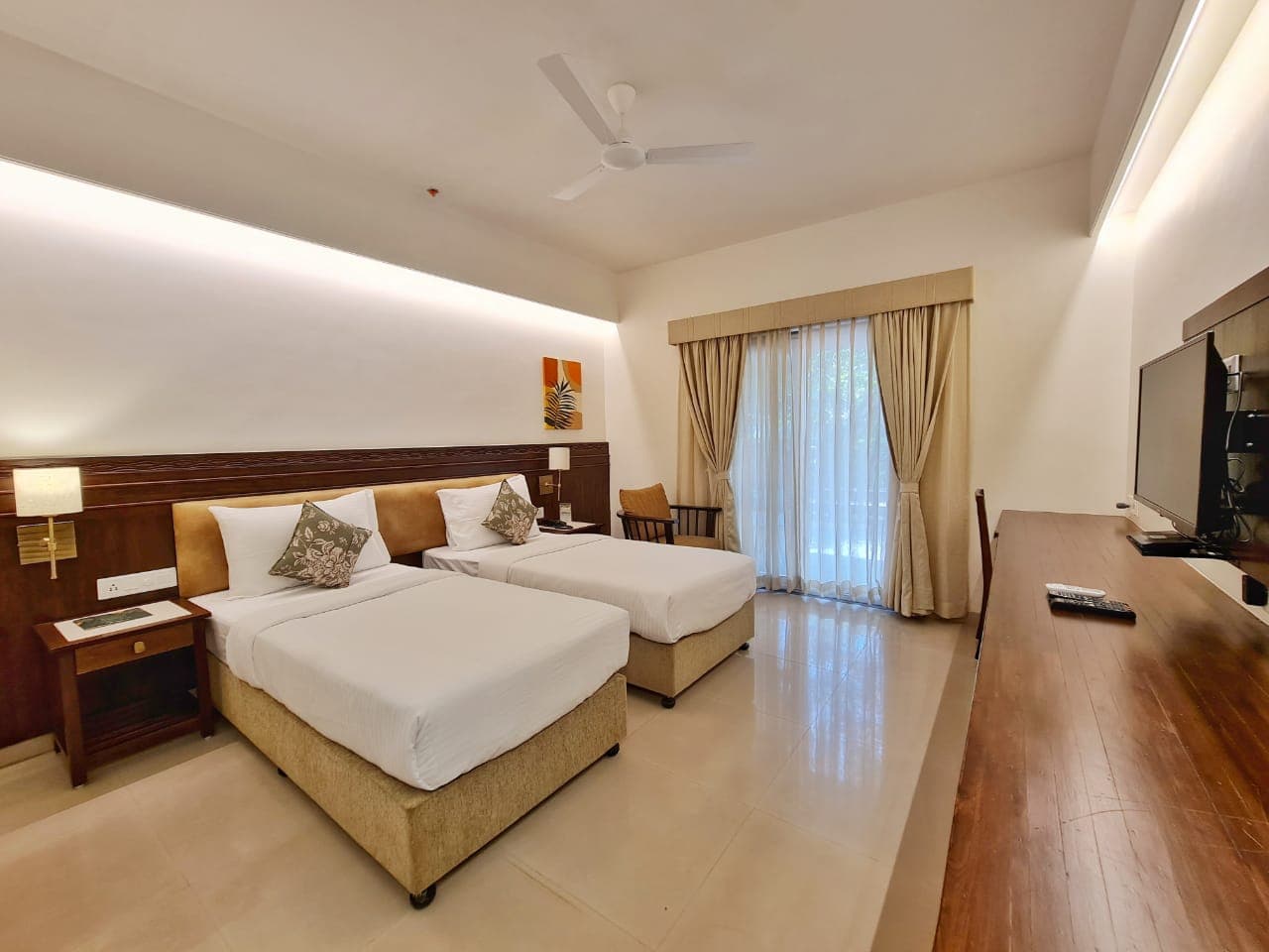 Deluxe room with warm wood accents and natural light