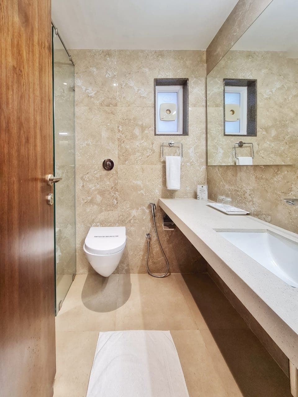 Executive room with lounge seating and warm lighting
