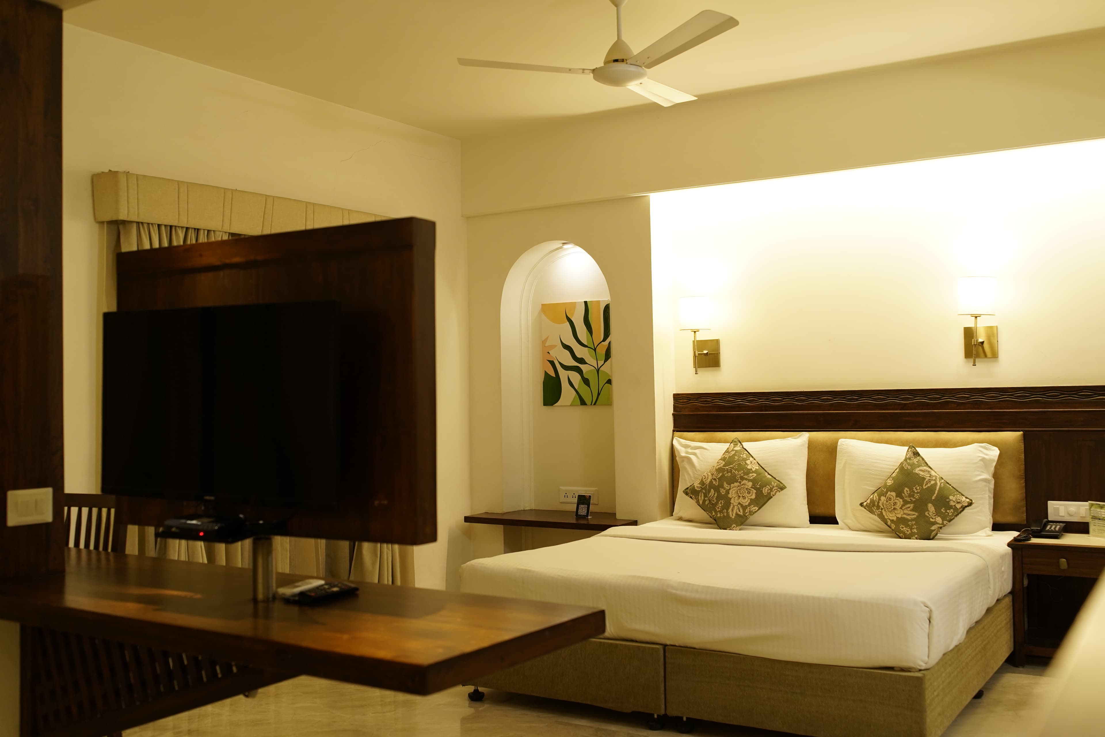 Suite room with king bed and lounge styling
